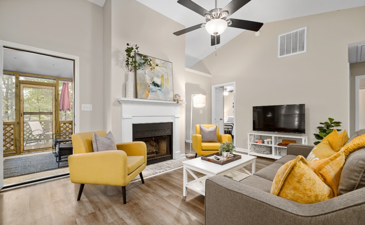 colorful living room with ceiling fan and ceiling light|ceiling fan with 4 blades in a spacious and modern kitchen|ceiling fan with light in elegant living room|wooden fan with 3 blades in a bedroom|ceiling fan on a porch in wood and garden