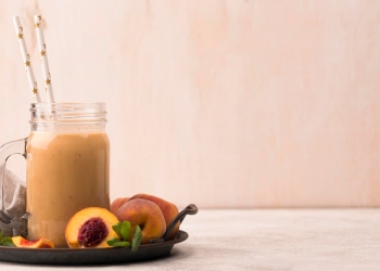 peach smoothie with sliced peaches