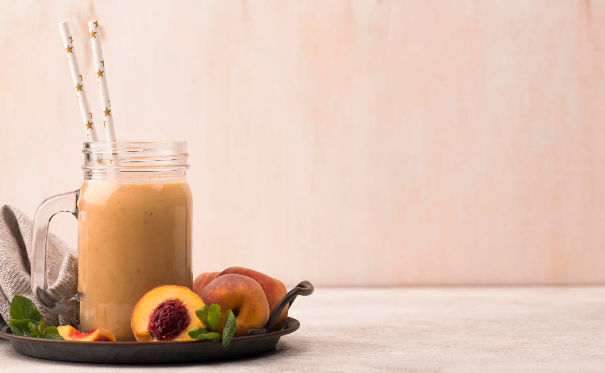 peach smoothie with sliced peaches