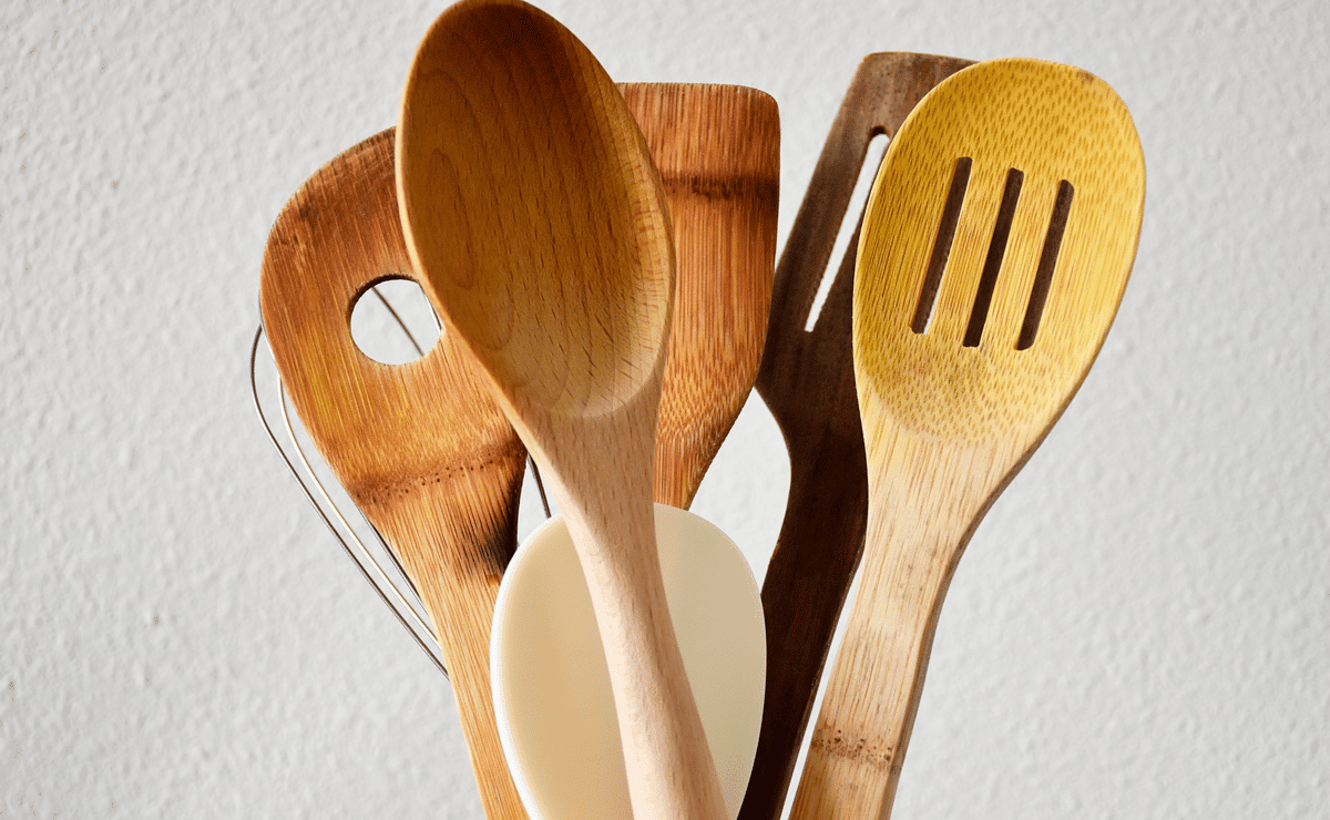 Close-up of various kitchen utensils made of wood.