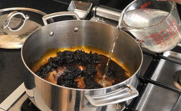 remove burnt vinegar baking soda pan