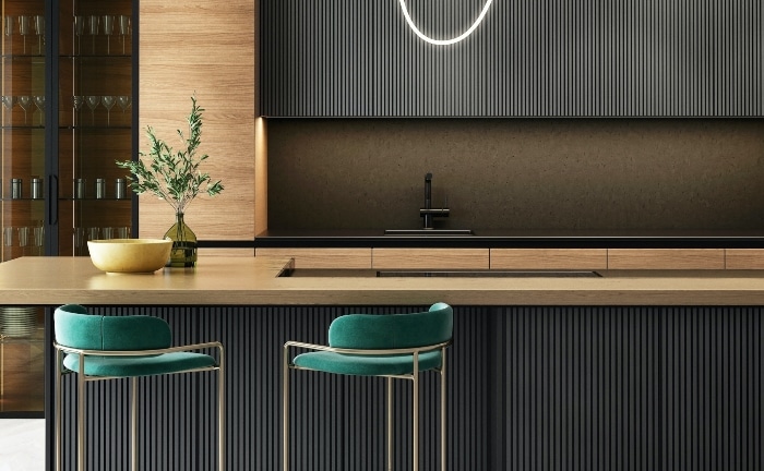 kitchen in black and wood with green banquettes